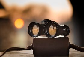 antique binoculars at top of case