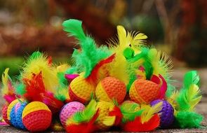 bright balls with yellow and green feathers