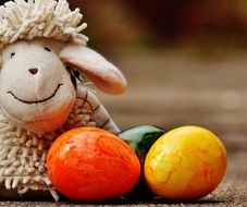 Sheep toy and colorful eggs