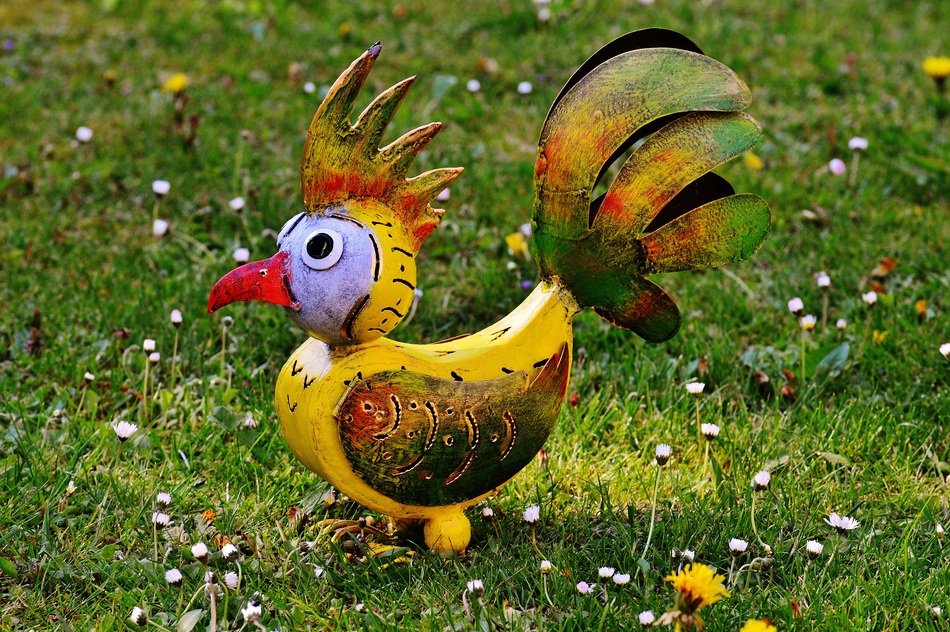 decorative element in the garden in the form of a cock