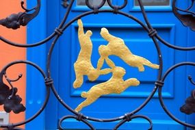 hares like golden logos on the gate