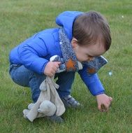 boy collecting Easter eggs