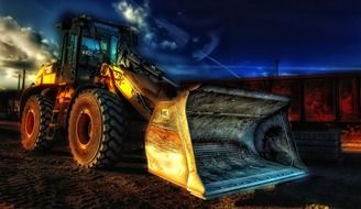 construction vehicle with a bucket in the dark