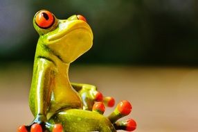 closeup picture of ceramic figurine of a toad sitting