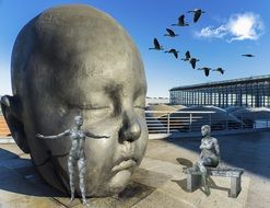 stone statue in the form of a childâs head