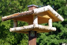 wooden house for feeding birds