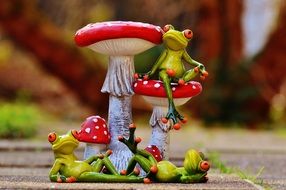 frog resting near a mushroom