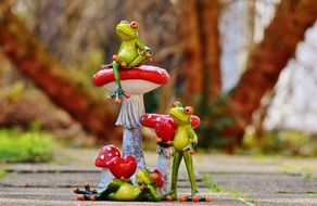 two frogs with hearts in hand on valentine&#039;s day