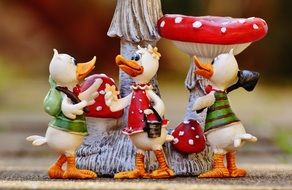 Cute colorful ceramic duck figures and fly agarics