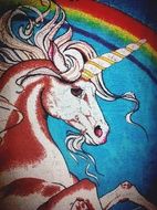 painted colorful unicorn and rainbow