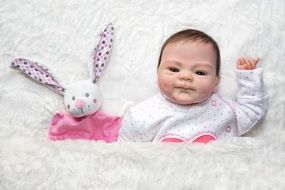 little baby with a doll