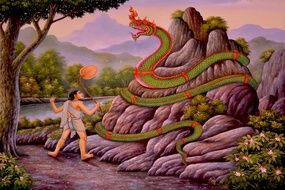 drawing of a buddha near a snake in thailand
