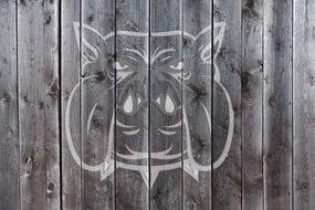 drawing a dog on a wooden fence