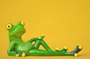 ceramic figure of a relaxing frog