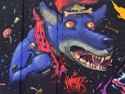 graffiti on the wall in the form of a purple wolf