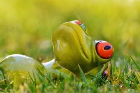 ceramic figure of a resting frog