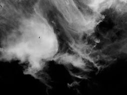 clouds in the black sky
