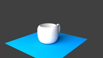 porcelain white coffee cup on blue surface