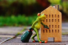 traveling frog with luggage