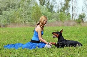 Doberman dog and woman