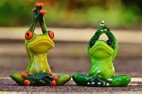 figures of meditating frogs