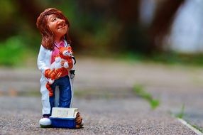 figure of a female veterinarian with cat