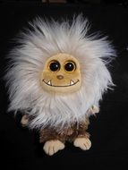 stuffed toy with fluffy mane and big eyes