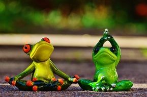 funny ceramic frogs practicing yoga