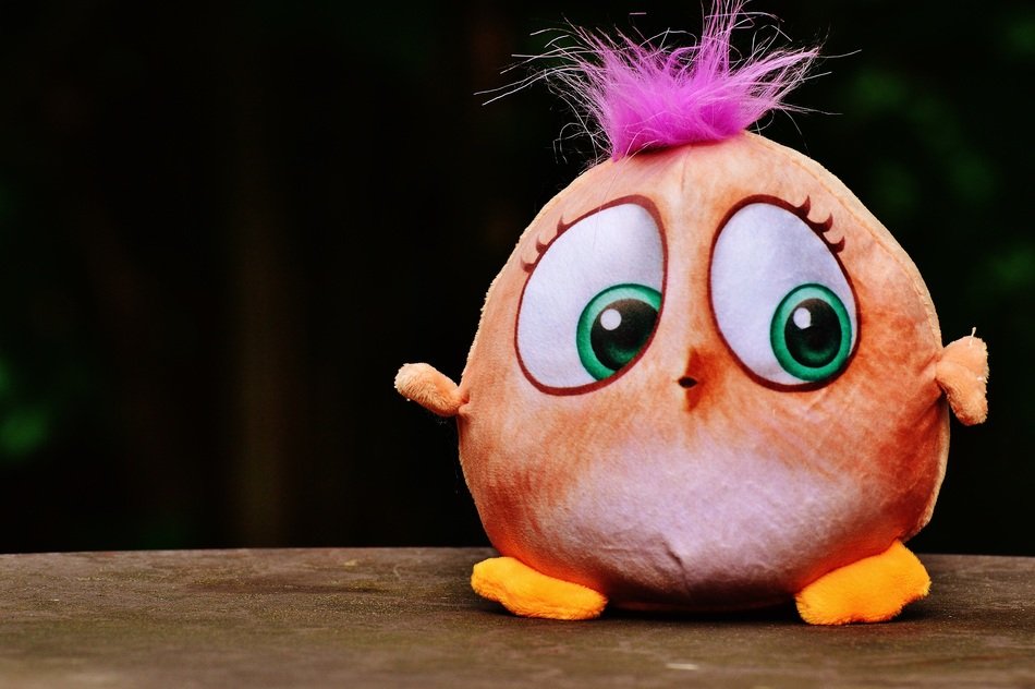 bird with green eyes and purple hair
