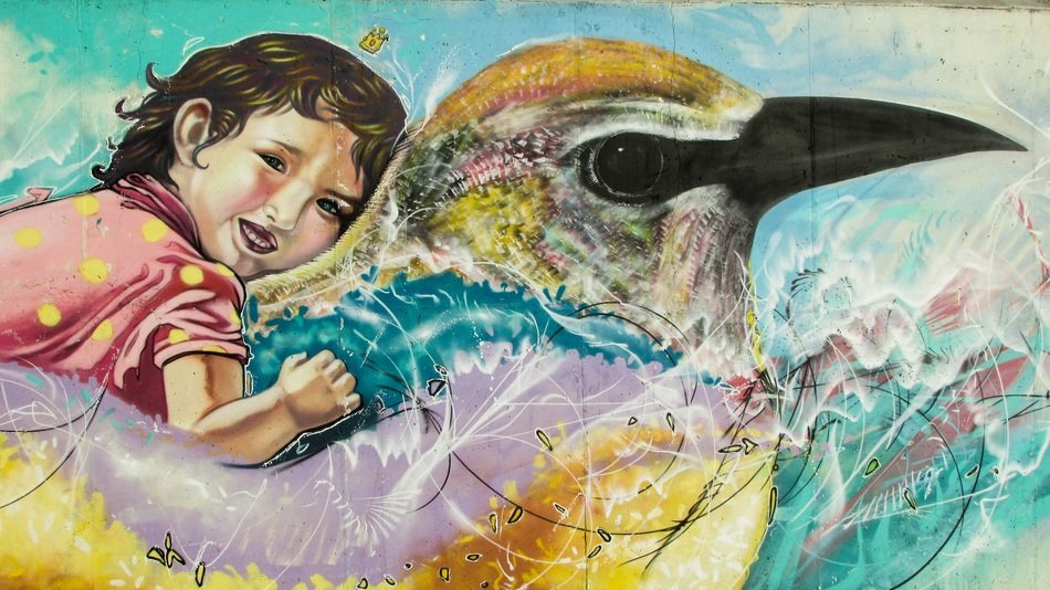 graffiti on the wall a girl on a bird in Ayia napa