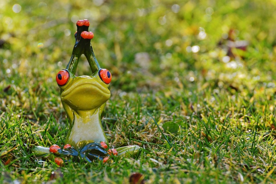 ceramic frog practicing yoga