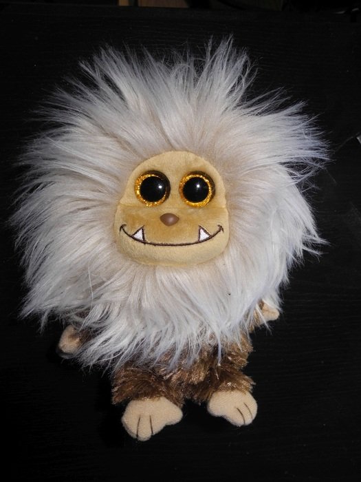 stuffed toy with fluffy mane and big eyes