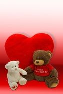 two teddy bears and a red heart