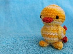 Tiny yellow bird figure