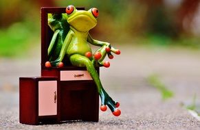 a small statuette of a frog-girl