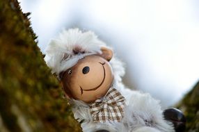 plush sheep on a tree