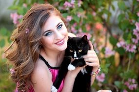 beautiful woman with a black cat