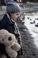 Black and white photo of the girl near the water