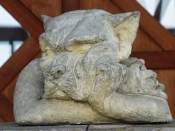 stone statue of bored wolf in the garden