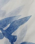 blue silhouettes of birds on white sand