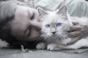 Black and white Portrait of the beautiful white cat with woman