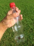 Bottle in right hand