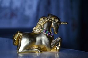statuette of a unicorn on a table
