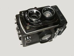 old camera on a white surface