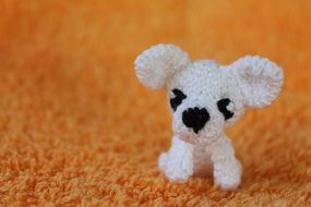 Cute puppy toy on the carpet
