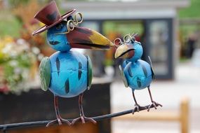 two toy crows with glasses decoration
