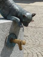 sculpture with a fountain in the city center