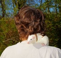 view from behind of beautiful hair and white mouse on shoulder