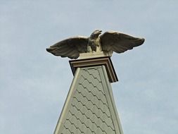 sculpture of an eagle on the tower
