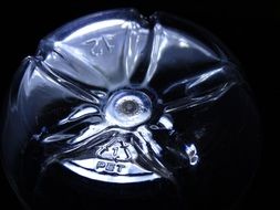 bottom of a plastic bottle close up
